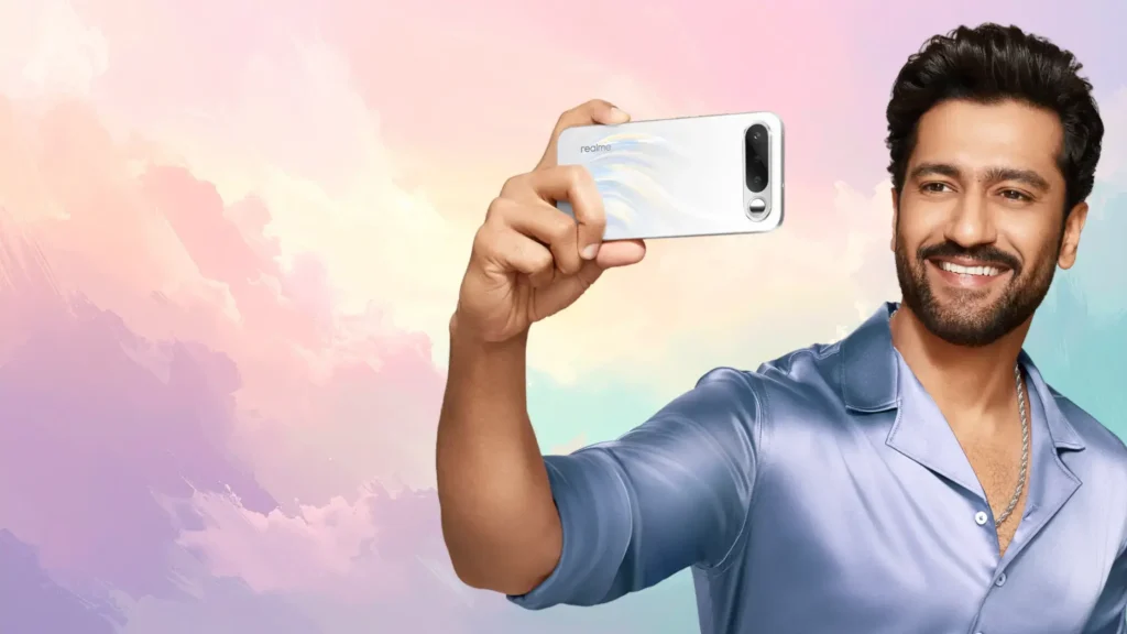 Man taking a selfie using Realme 16 5G smartphone with rear camera and selfie mirror feature against a colorful pastel background
