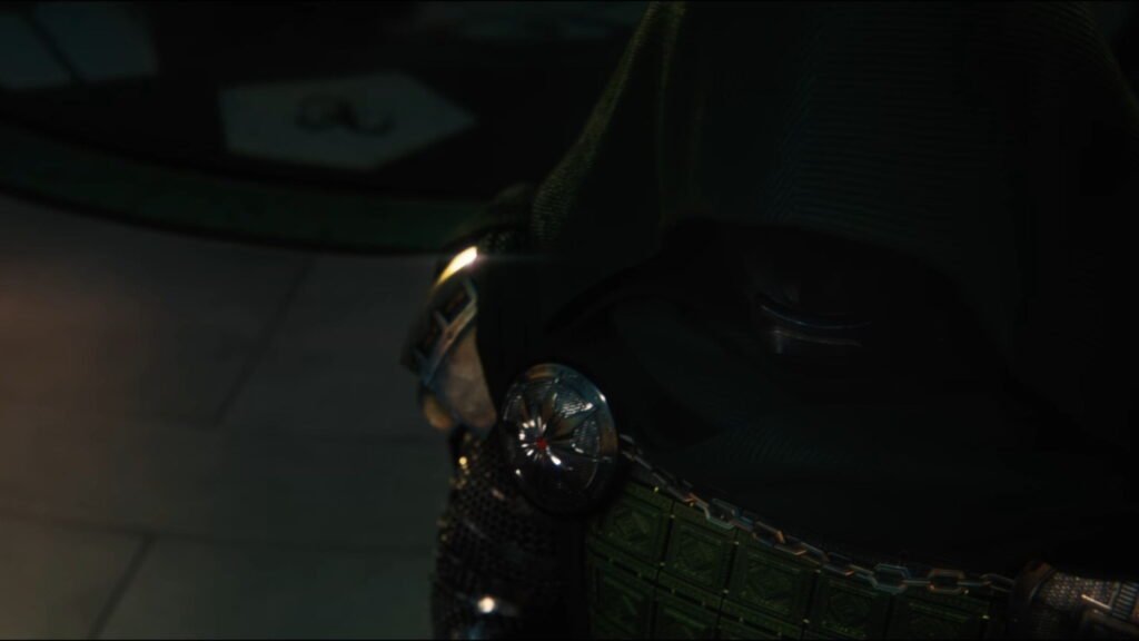 Dr. Doom stands in a ruined landscape as green light glows through the scene.