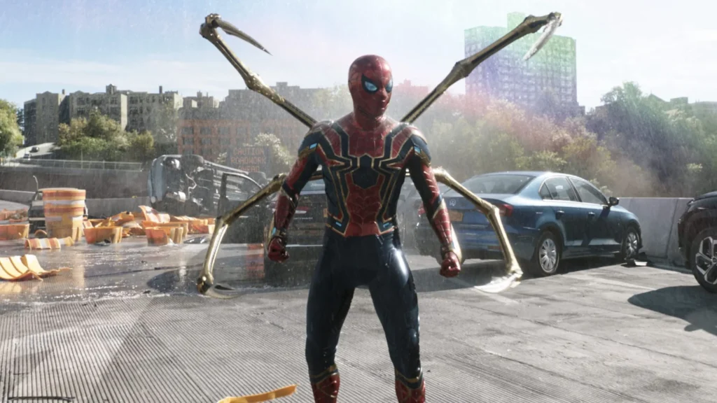 Spider-Man in his Iron Spider suit with four mechanical pincers extended on an urban highway bridge.