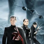 Ian McKellen as Magneto holding his helmet, Rogue, and Lady Deathstrike standing in front of dark tornadoes and the X-Jet in X2: X-Men United.